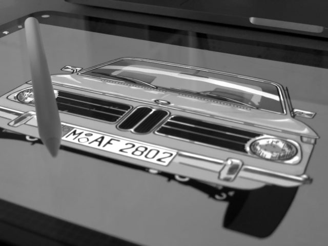 Close up of tablet with an illustration of a car